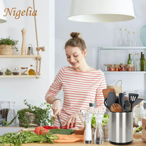 Woman slicing vegetables in kitchen with Extra Large Stainless Steel Rotating Utensil Holder For Countertop visible