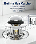 Bathtub Drain Stopper Pop-Up Tub Stopper Hair Catcher in chrome finish, trapping hair and debris in a bathroom sink.