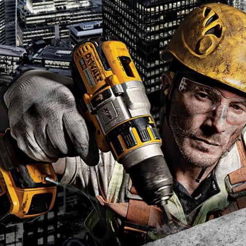 Heavy Duty 18V Brushless Cordless Drill And Impact Driver Combo Kit in use by a worker on a construction site.