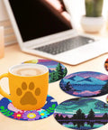 Eight Piece Diamond Art Coaster Kit With Holder Landscape Themed Full Drill Rhinestone Coasters placed on table