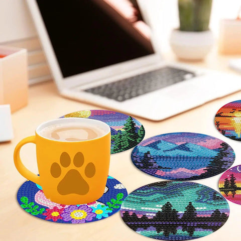Eight Piece Diamond Art Coaster Kit With Holder Landscape Themed Full Drill Rhinestone Coasters placed on table