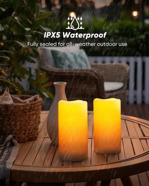 Lit Outdoor Solar Pillar Candles 3x6 Inches Waterproof Rechargeable Flameless Flickering Lights on outdoor table in rain