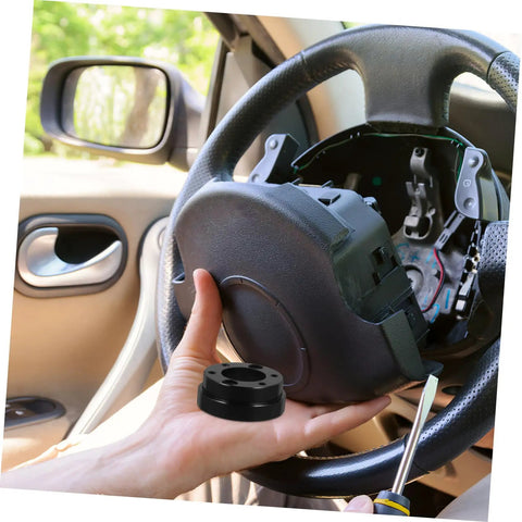 Hands holding Racing Car Steering Wheel Adapter Plate And Riser Spacer For Pro Grade Control And Comfort inside vehicle