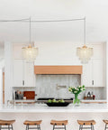 Straight Up Gold Plug In Pendant Light With 16 Foot Long Cord And Sparkling Three Tier Crystals For Kitchen Island Or Cozy Bedroom Setup Premium Slick Mini Chandelier Drip hanging in modern kitchen over bar stools.