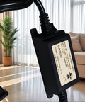 Close-up of 24V DC 1A LED Power Supply, 24W Constant-Voltage Transformer, Black, in indoor setting, showing IP67 waterproof label.