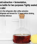 Polished Glass Cold Brew Coffee Maker Featuring Precise Drip Valve And Rugged Stainless Steel Base, 500ml capacity with cork lid.