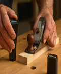 Hands using 2 Inch Aluminum Round Bench Dogs With Beefy Side Spring For Thin Benchtops And Woodworking Tools Easy Height Adjustment