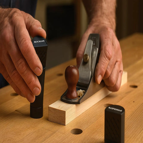 Hands using 2 Inch Aluminum Round Bench Dogs With Beefy Side Spring For Thin Benchtops And Woodworking Tools Easy Height Adjustment