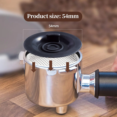 54mm Breville backflush cleaning disc; two-pack, black plastic with center plug, shown installed on group head.