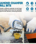 Diamond step drill bit in gold attached to a handheld grinder, drilling a round hole in a stone countertop.