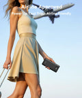 A woman holding a rugged portable power bank delivering 22.5W fast charging through four built in cables for plug and play convenience.