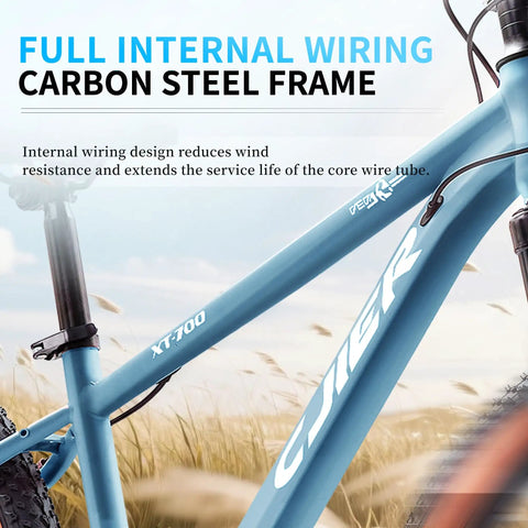 Close-up of blue Kids Mountain Bike For Boys And Girls 24 or 26 Inch with internal wiring on carbon steel frame in field