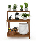 Tioman Outdoor Potting Bench In Natural Hardwood For Small Patios And Balconies With A Tall Open Frame And Slatted Shelves That Drain Water