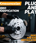 Mechanic holding brake rotor with text about zero modification plug and play installation, featuring brake pads and tools nearby.