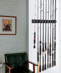 Two Pack Vertical Fishing Rod Rack Wall Mounted Holder That Stores Up To Eighteen Rods Or Combos Fits Most Rod Diameters From 0.12 To 0.75 Inches Perfect Garage Storage For Fishing Gear And A Dope Gift For Men installed on wall with rods.