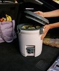 Hardcore Two Gallon Insulated Water Jug Featuring Double Wall Foam Build Keeps Your Daily Hydration Frosty Fresh On Any Campout Or Weekend Grind Session in car trunk with drinks