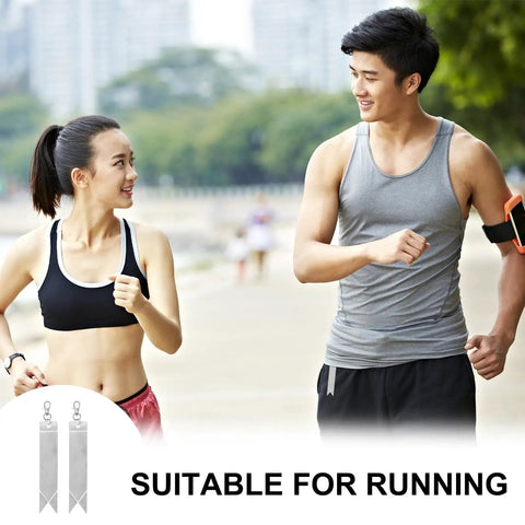 Two people jogging with 12 Pack Reflective Safety Pendants for Backpacks, Bags, Keychains and Gear, Silver Reflectors for Night Running.
