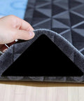 Hand lifting carpet corner showing 16 Pack Rug Gripper Pads For Hardwood Floors And Tile Non Slip Double Sided Tape Reusable No Residue
