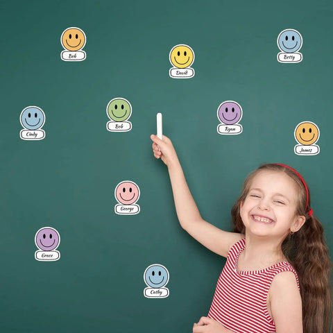 Smiley Name Tags Pack 120 Pcs Boho Pastel Smile Face Nameplates For Classroom And Office Labeling on a green board with a smiling child