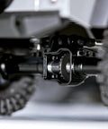 Close-up of Beefy Steel Helical Gear Set For One Eighteen Traxxas TRX4M RC Crawler Front Overdrive in axle with 22T gear exposed.