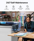 Top Shelf Apparel Printer Bundle With Seamless Humidification Dual Sensor Monitoring Integrated White Ink Cycle Heavy Duty Shaker Oven And Industrial Fume Extractor System For Hustlers showing self-maintenance features and application in a workspace.
