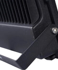 Close-up of JUDYSSY Solar Flood Lights Led Solar Floodlight metal housing with cooling fins and adjustable bracket.