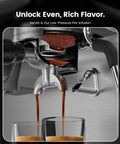 Close-up of the premium dual boiler espresso machine with integrated grinder extracting espresso into glasses.