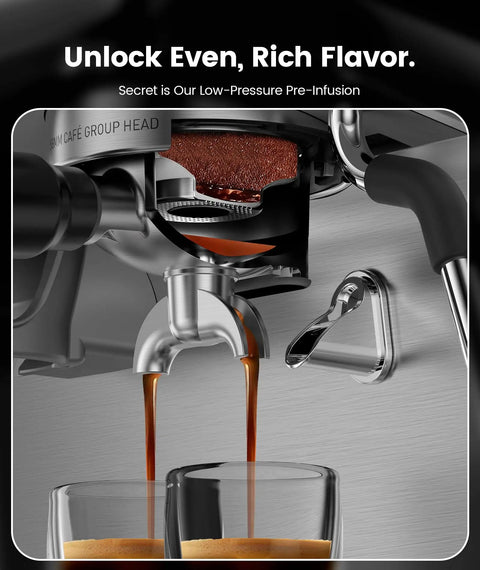 Close-up of the premium dual boiler espresso machine with integrated grinder extracting espresso into glasses.