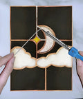 Hands using 60/40 Stained Glass Solder for Copper Foil, 3mm Diameter, 1 Pound Spool, Tin Lead Alloy on moon and clouds panel.