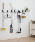 Heavy Duty Wall Track Storage System With Two PVC Panels And Seven Hooks for organizing tools and gear in garage or shed.