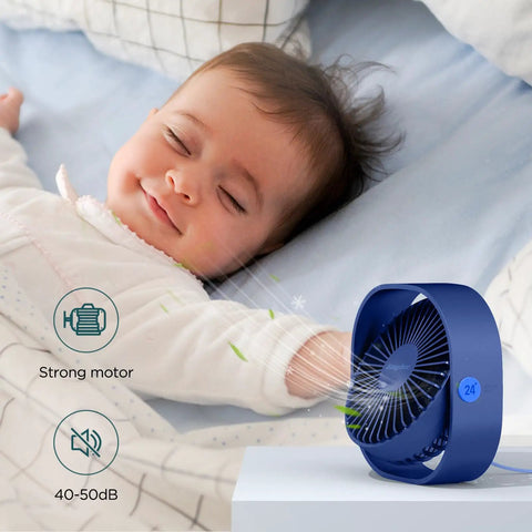 Blue Go To Ultra Quiet USB Desk Fan With 360 Degree Rotatable Head next to sleeping baby in bedroom setting