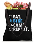 Gravel Bikepacking Tote Bag For Eat Bike Camp Repeat Adventure Lovers With 16x16 Inch Lightweight Polyester Canvas Dual 14 Inch Black Webbing Handles Trail Ready filled with groceries.