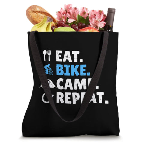 Gravel Bikepacking Tote Bag For Eat Bike Camp Repeat Adventure Lovers With 16x16 Inch Lightweight Polyester Canvas Dual 14 Inch Black Webbing Handles Trail Ready filled with groceries.