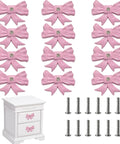 12 Piece Pink Bow Dresser Knob Set For Cabinets And Drawers Cast Iron Vintage Coquette Girly Drawer Pull Handles displayed with screws and drawer