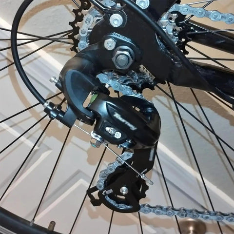 Rear Derailleur RD TY300 SGS 6 To 7 Speed Hanger Mount on bike frame, close-up view of black derailleur mechanism