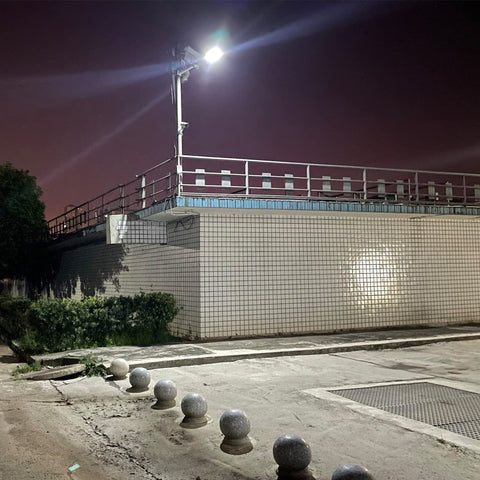 60000 Lumen Solar Street Light Outdoor Waterproof IP65 Dusk To Dawn With Motion Sensor And Remote Control illuminating a courtyard
