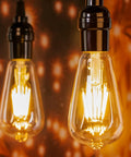 Close-up of glowing 12 Pack LED Edison Filament Bulbs 6W 750 Lumens Equivalent To 60W 2700K Warm White Non Dimmable E26 ST58