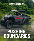 Top Shelf Polaris Linkage Assembly For RZR Stabilizer Bar OEM 1542304 side by side vehicle navigating off-road terrain.