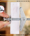 Close-up of Heavy Duty Carbon Steel Toggle Bolts Wall Anchors Kit With Anti Spin Design for Drywall installation shown in hand