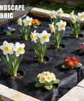 Garden bed with landscape fabric and colorful flowers showing secured setup using Heavy Duty 8 Inch Plastic Landscape Edging Spikes.