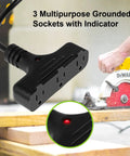 Close-up of 30 Ft Retractable Extension Cord Reel With 16/3 SJTW Heavy Duty Power Cord And Three Outlets, used in workshop.