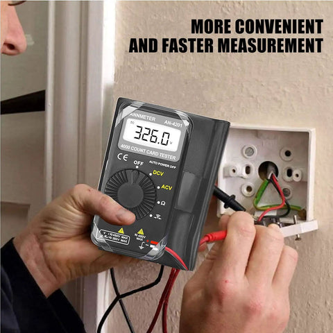 Hand using Pocket Handy Digital Multimeter For DIYers Auto Ranging Volt Ohm Meter Measures AC And DC Voltage Resistance Continuity
