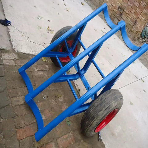 Tough As Nails Heavy Duty Pole Hauler Cart For Concrete Utility Lines And Long Material Transport With Swivel Casters And Bulletproof Steel Chassis Assembly, blue steel frame with red tires.