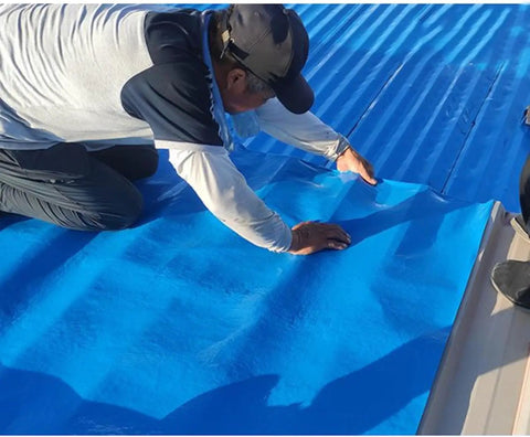 Heavy Duty Self Adhesive Asphalt Roofing Tape With Thick Aluminum Foil Rock Solid Shingle Repair Seal Waterproof Flashing Roll To Patch Up Leaky Sheds Shacks And Flat Roofs Real Quick Blue being applied to a roof.