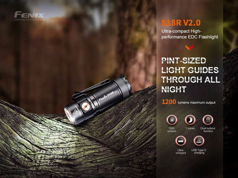 E18R V2.0 1200 Lumen EDC USB C Rechargeable Flashlight on a rugged outdoor surface, showing compact design and features.
