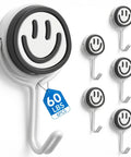 Six Piece Heavy Duty Magnetic Hooks With Smooth Swivel Action And Fresh Smiley Vibe For Keeping Your Fridge Locker Or Garage Slick While Hauling Heavy Gear At 60 Lbs, showing white smiley hooks on a white background.