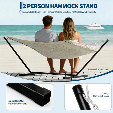 12 Ft Hammock Stand With Hooks And Chains For Two Beefy Heavy Duty Steel Frame For Outdoor Patio Backyard Portable Black Design Supports Up To 450 Pounds shown with two people on a beach.