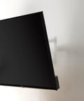 Built Tough Full Motion TV Wall Mount With Effortless Swivel And Tilt Angles For Twenty Six To Fifty Five Inch Screens Handling Up To Eighty Pounds mounted on a wall.
