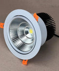 JUDYSSY Adjustable Led Floodlight 3-15W High Efficiency Cob Ceiling Light showcasing sleek white design with cooling fins for downlighting.