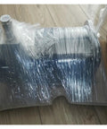 Integrated Stepper Motor ILS1U851PB1A0 wrapped in plastic, black metal housing with shaft for industrial automation